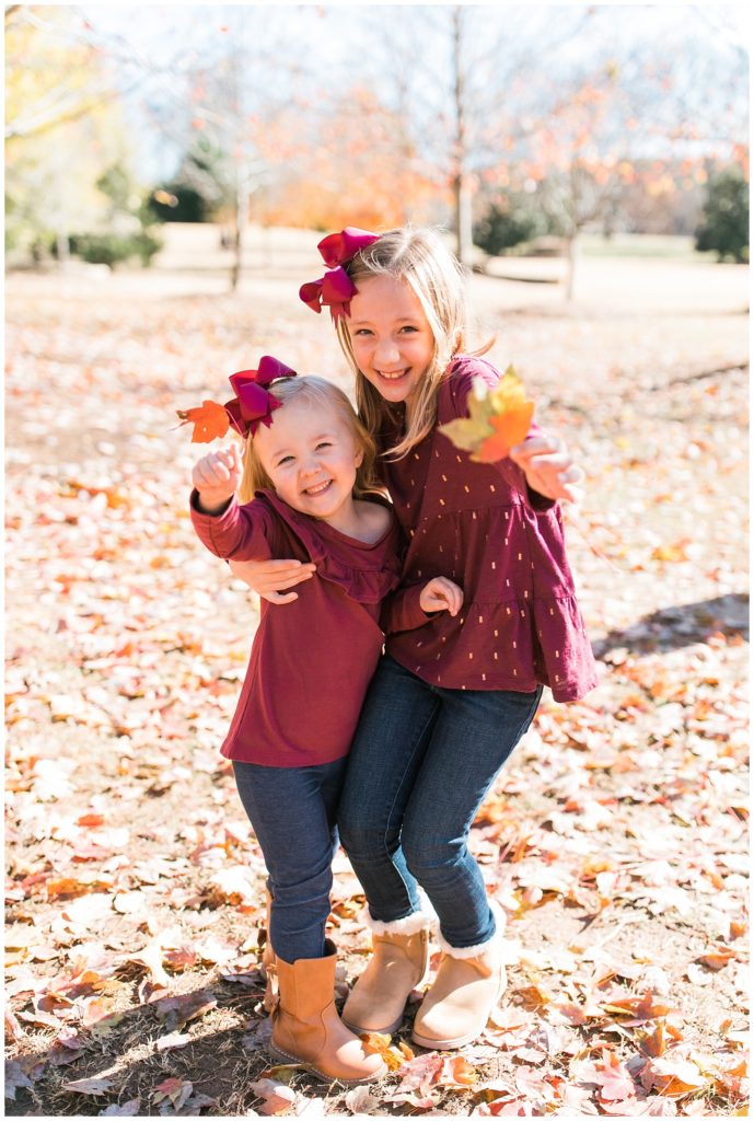 Wake Forest Photography sisters holding leaves