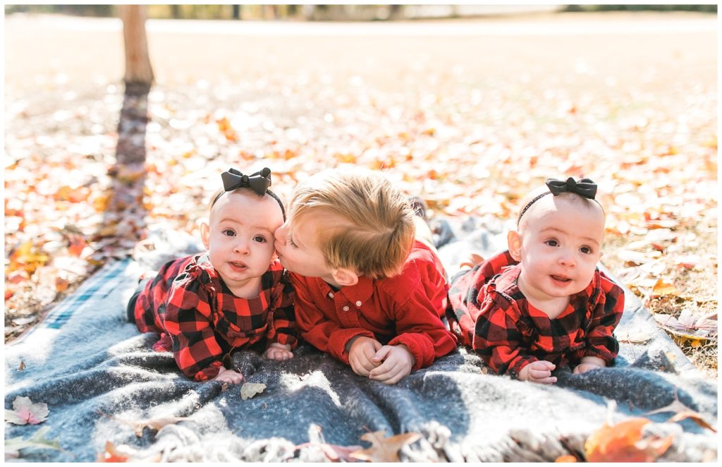 Wake Forest Photography twins and brother kiss on cheek