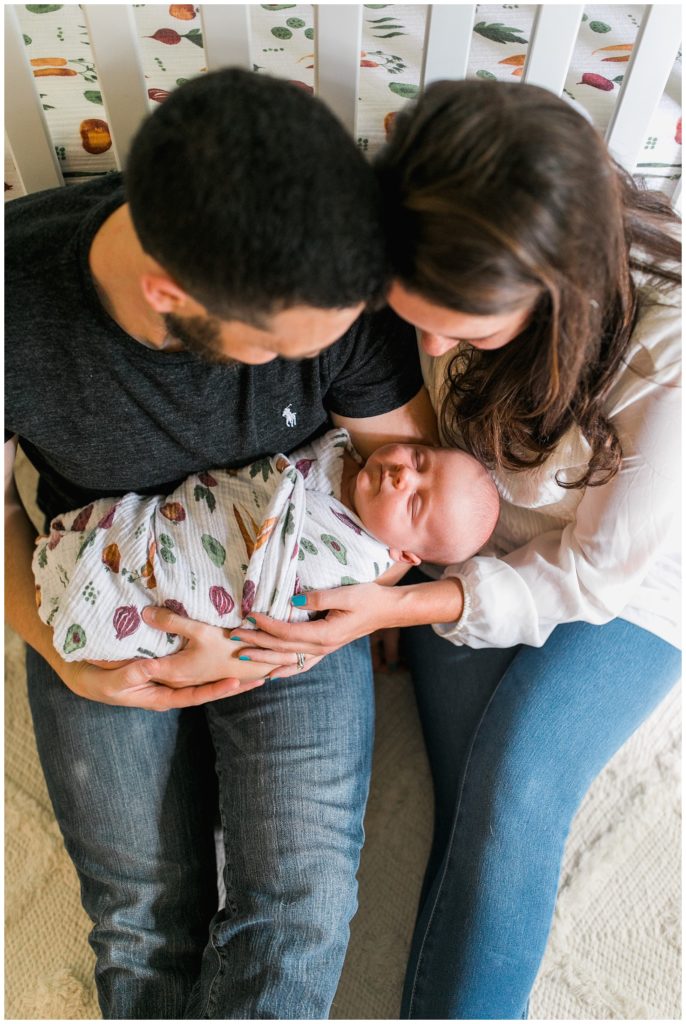 Baby boy with family newborn lifestyle session raleigh