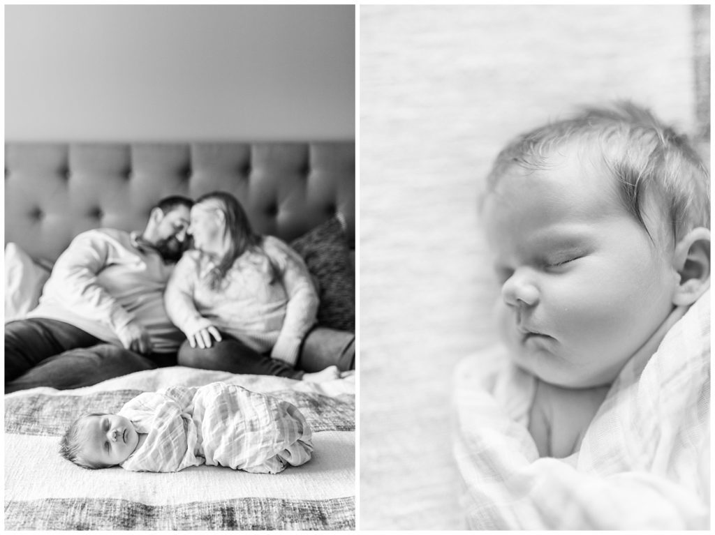 black and white photo baby on bed with family newborn session