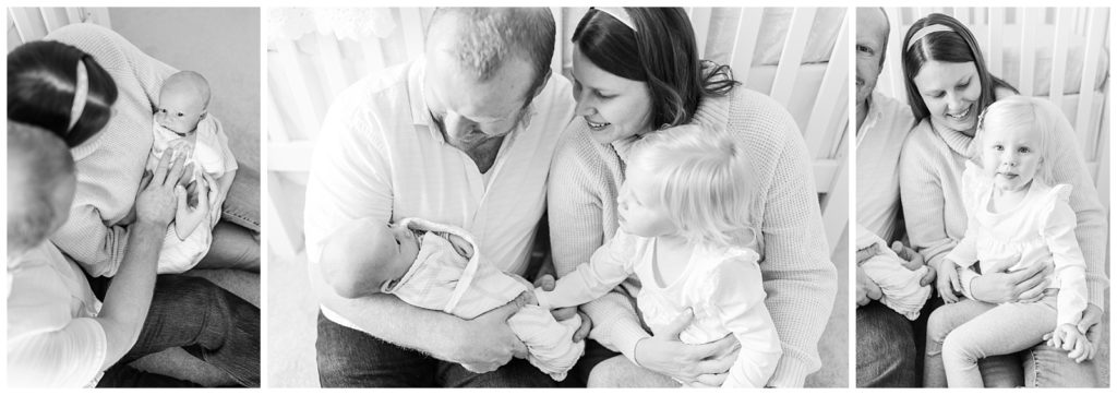 Black and white family with newborn in nursery