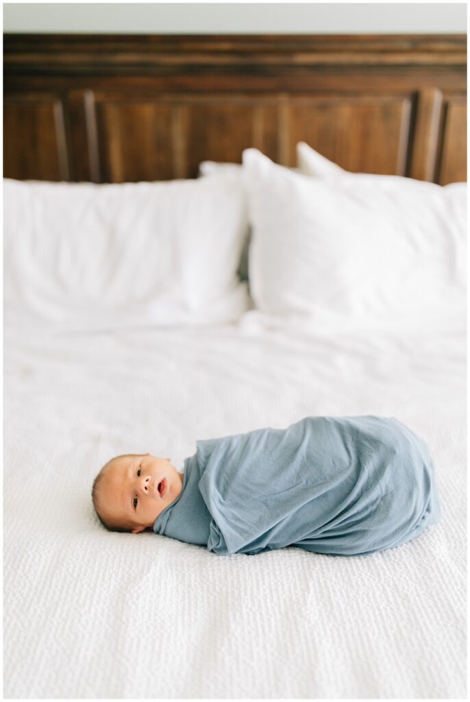 Wake Forest newborn lifestyle photography baby on bed